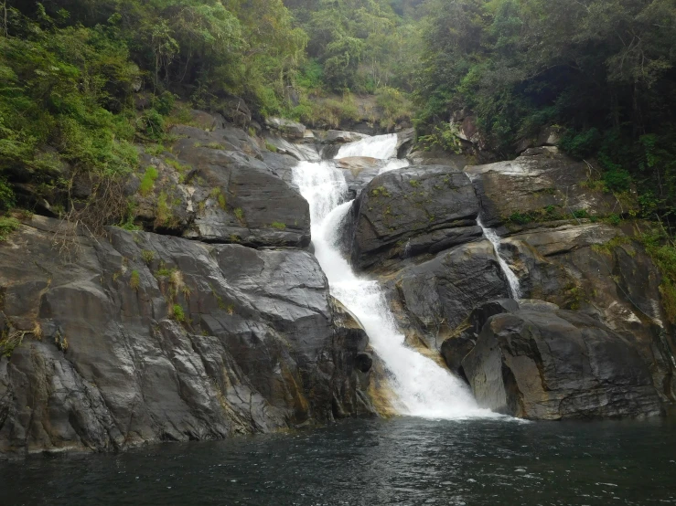 a waterfall in a body of water