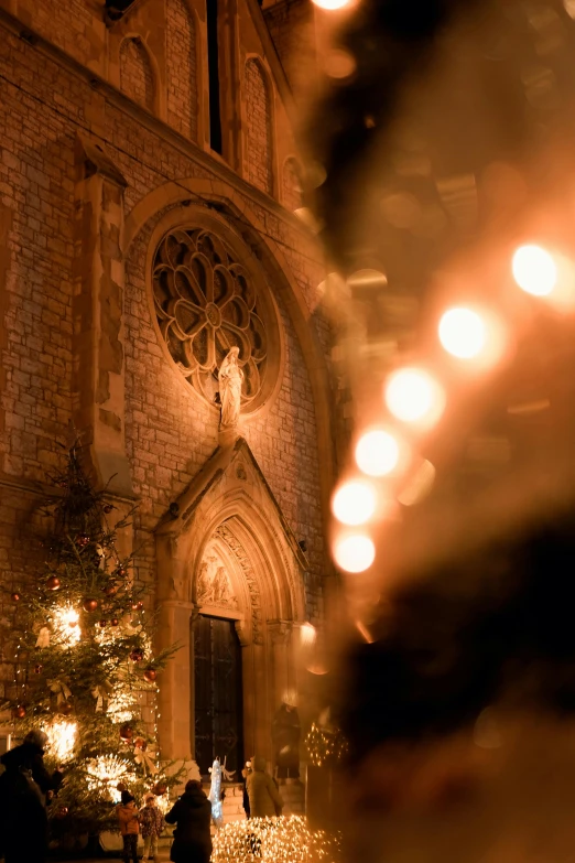 a church with candles inside of it and on the wall