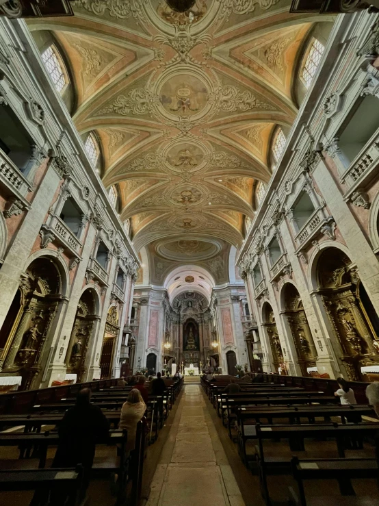 the ceiling of this large church looks like it has been painted gold