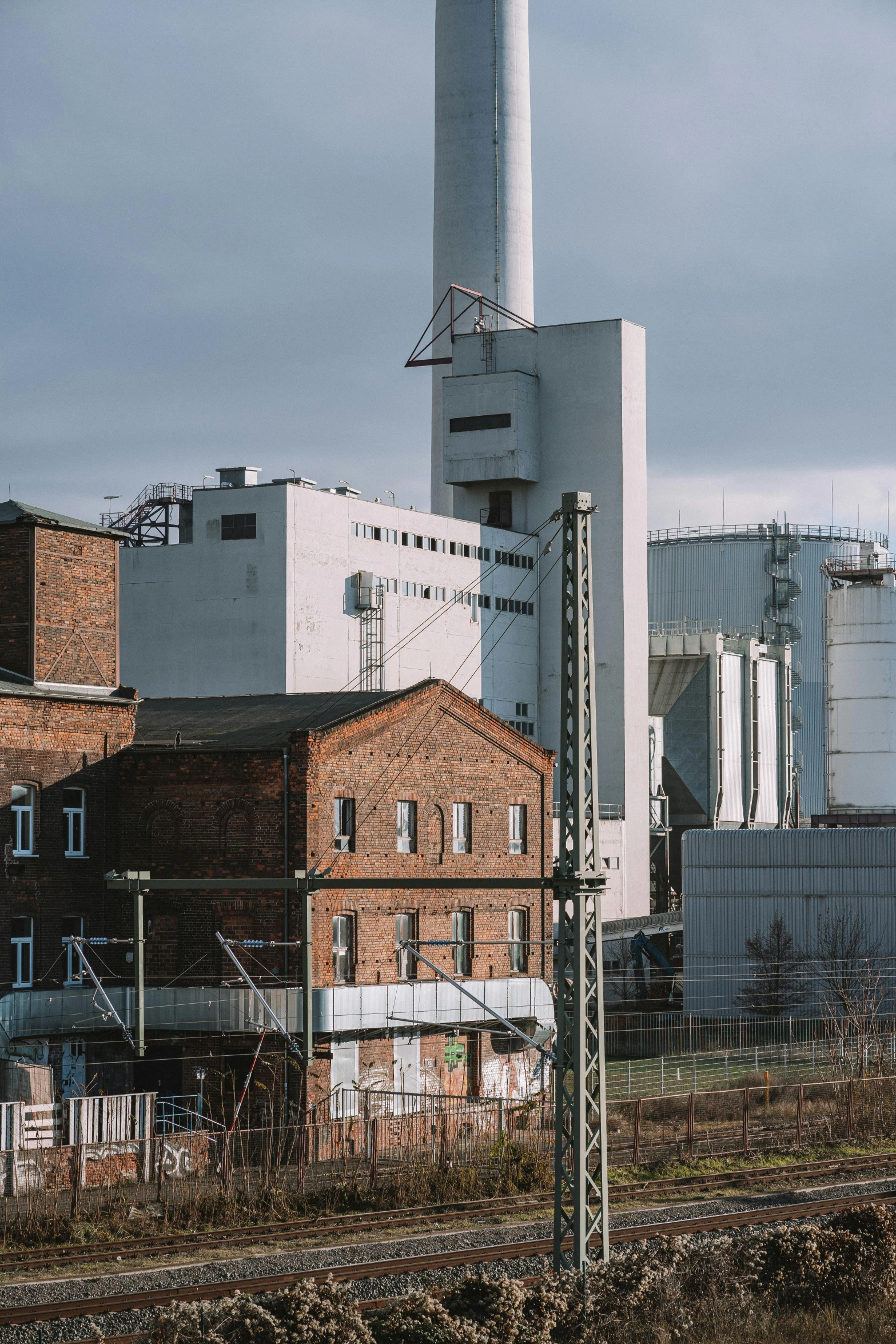 a white building with chimneys on the roof of it