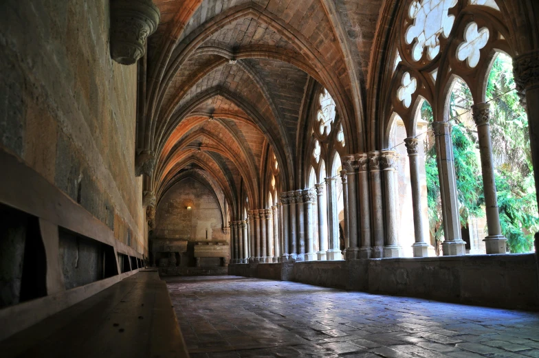 an old cathedral with a stone floor and arches