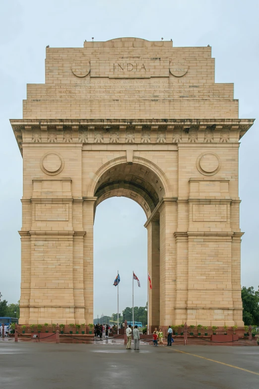 an arch with many different flags hanging from it