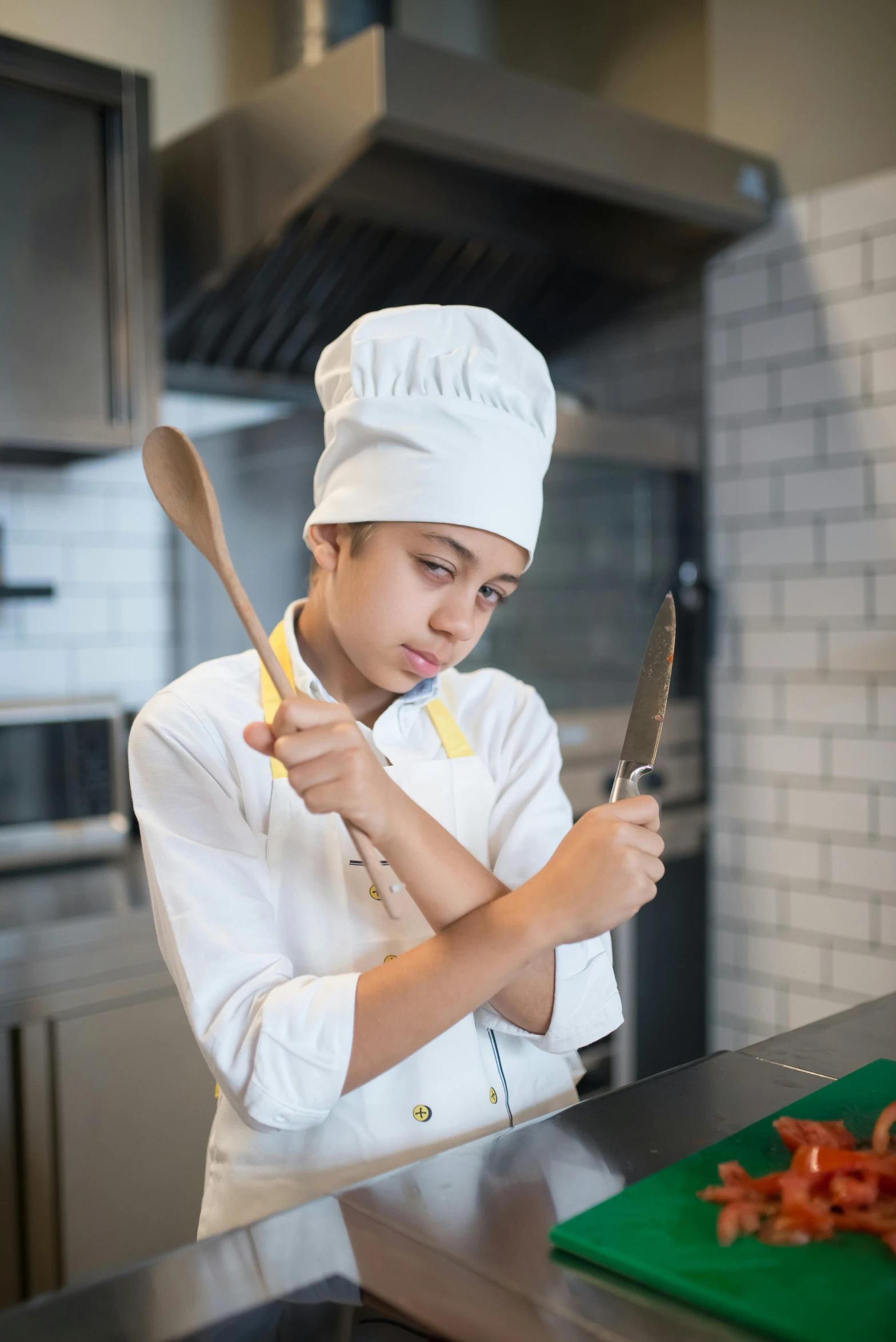 a  in a chef's outfit cooking in a kitchen