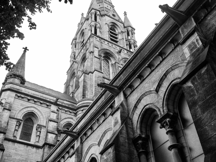 a tall tower with spires behind it