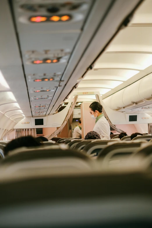 a plane with an attendant at the back