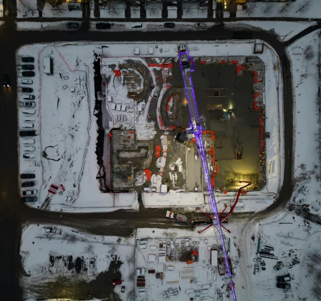 a view from above shows a snow covered parking lot and airport