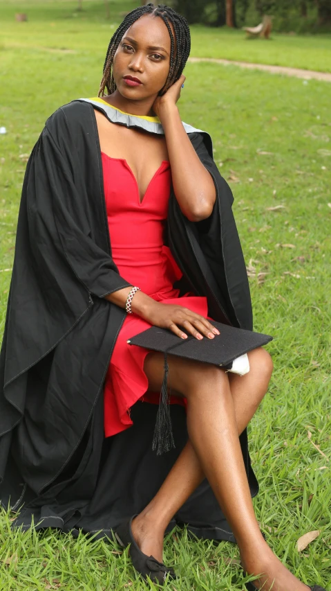 an image of a woman sitting on the grass