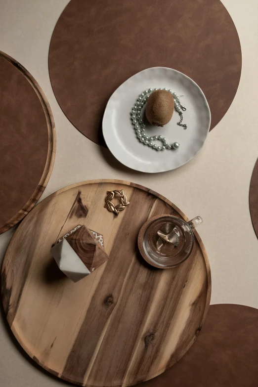 some table top items on a brown and white surface