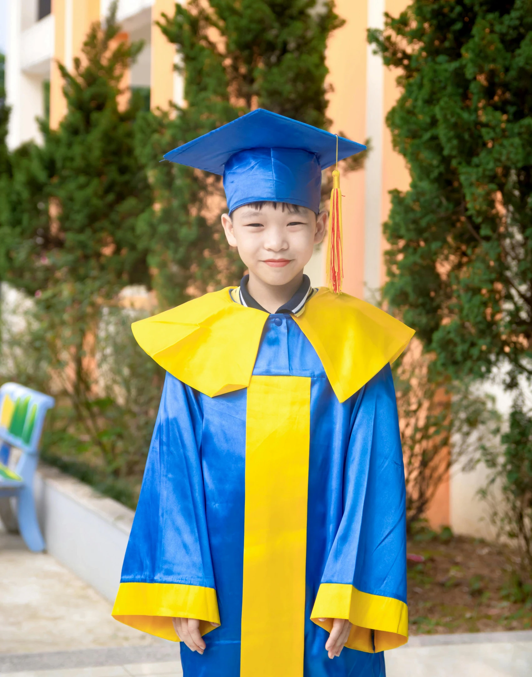 the  is dressed in his blue graduation gown