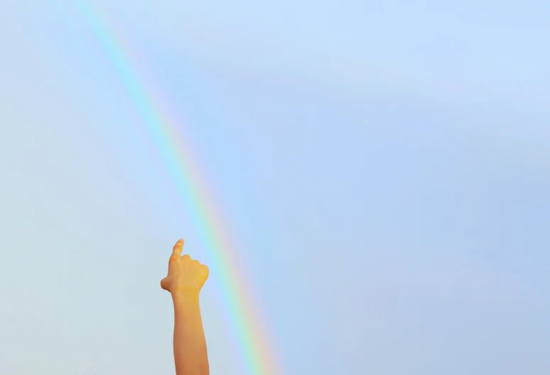 there is a tall rainbow over the sky