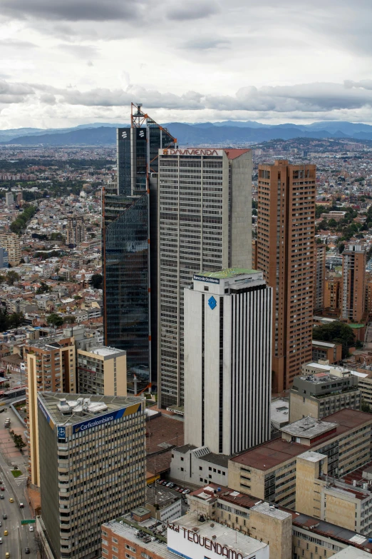 several large buildings in the city one behind another