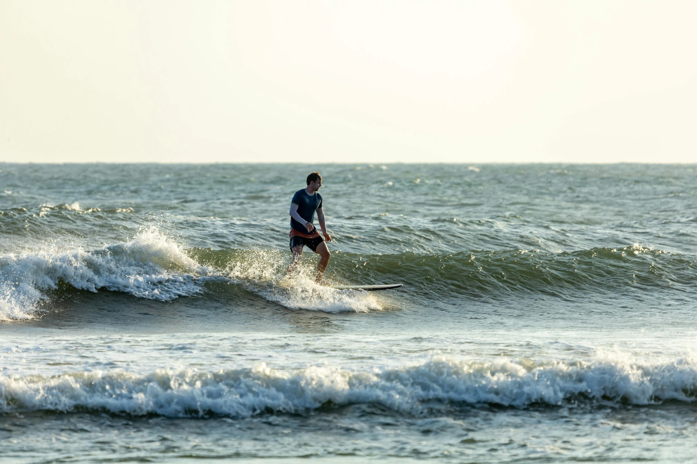 a surfer is waiting for the waves in the water