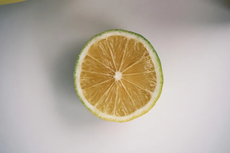 a lemon cut in half on top of a table