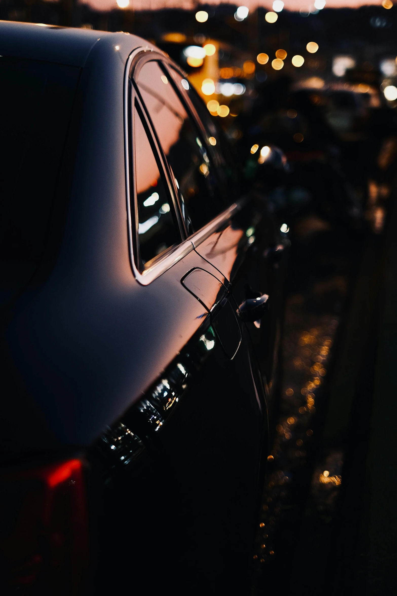 the view from a car's window at night of parking lot