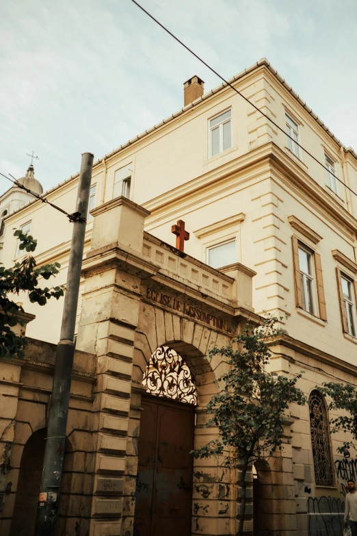 a brown and beige brick building on a street corner