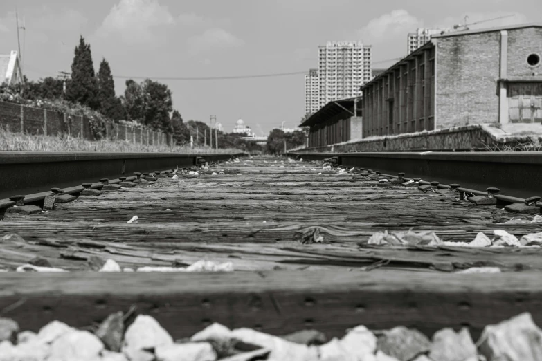 a close up of train tracks near city buildings