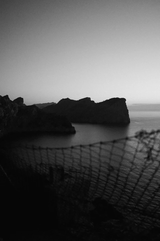 black and white po of an island with a wire fence