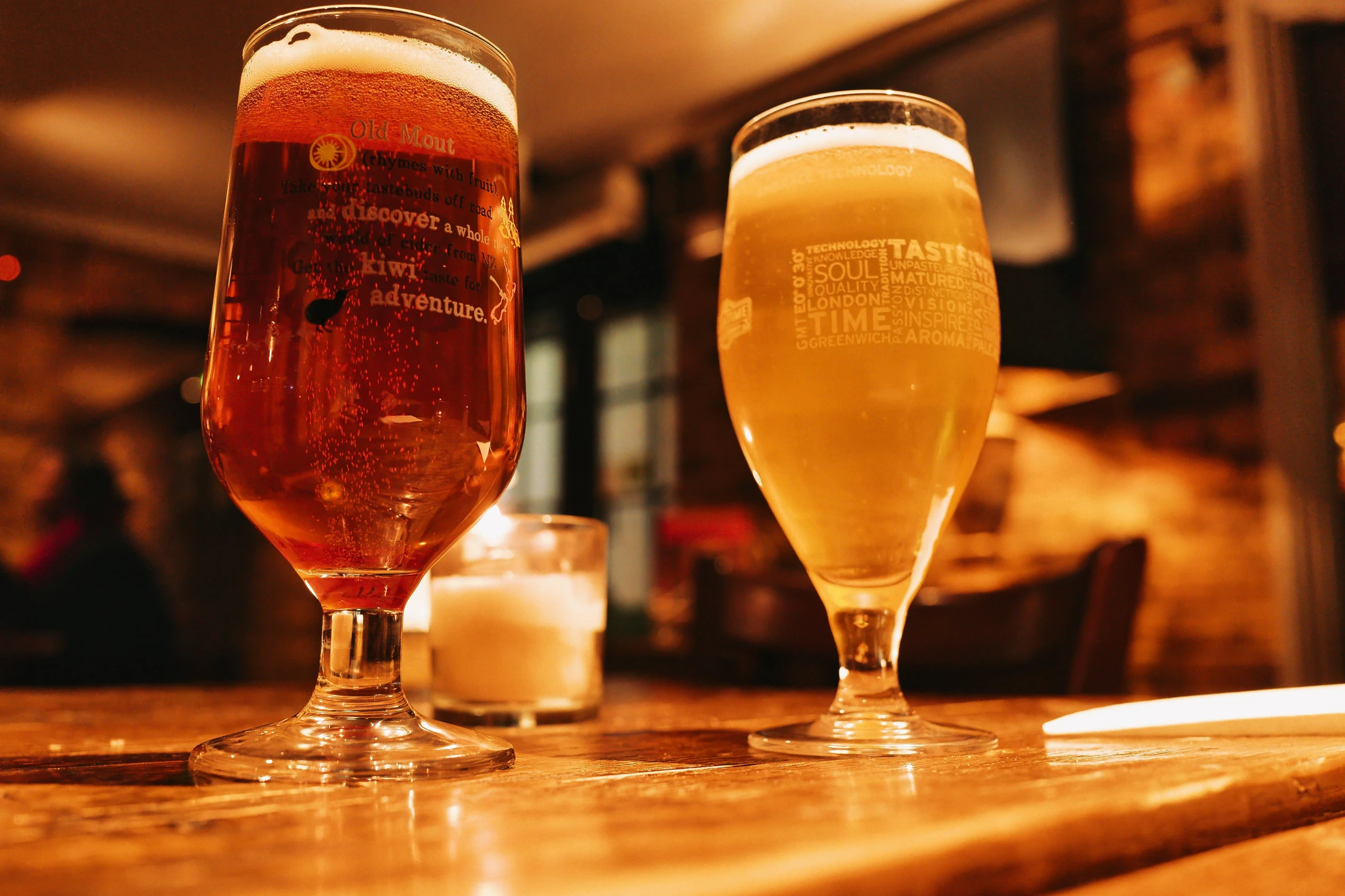 three beers are on the table near the beer glass