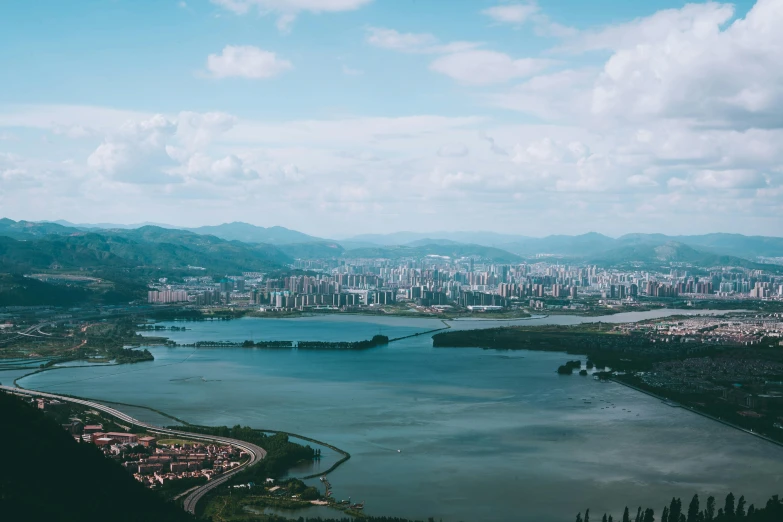 an aerial view of a large body of water surrounded by mountains