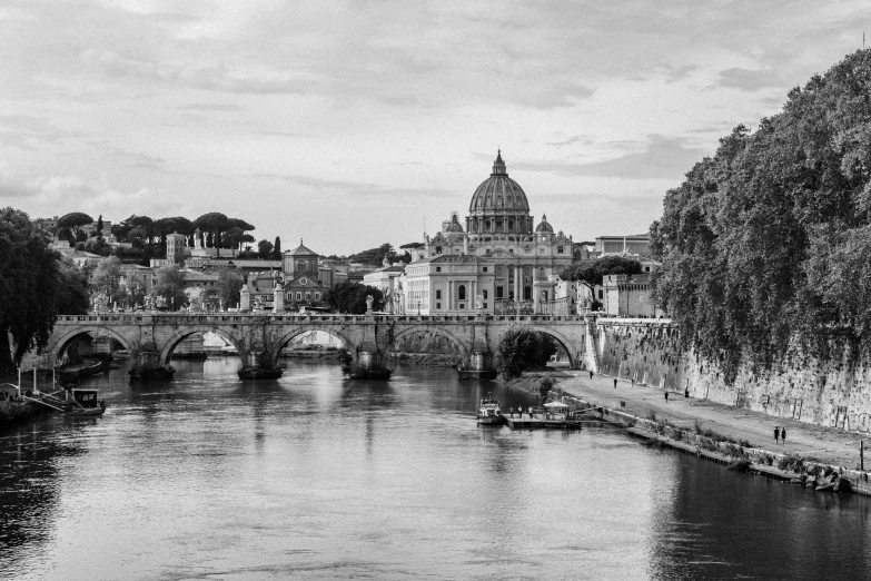 black and white pograph of a bridge over a river