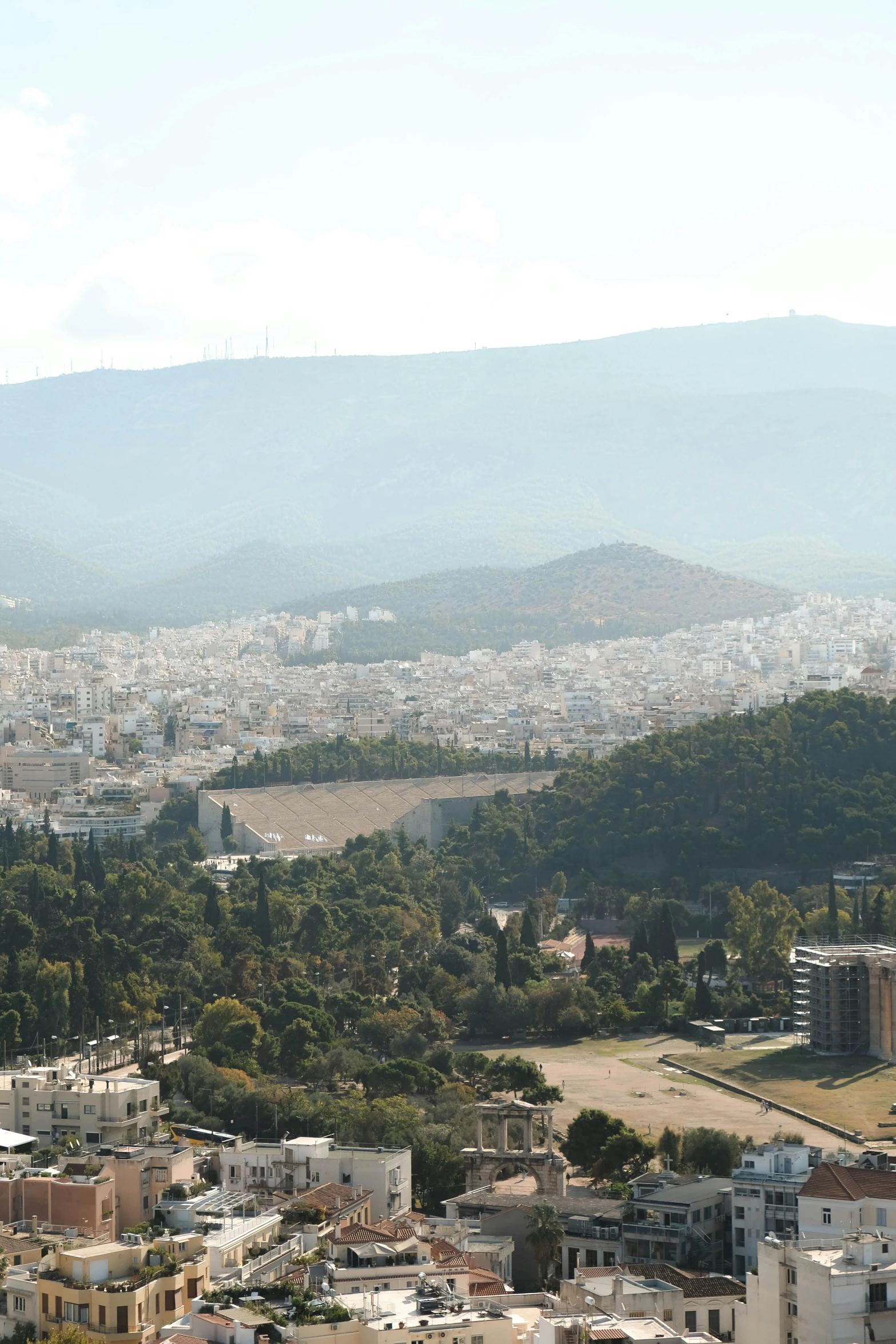 cityscape in the background with buildings and a road