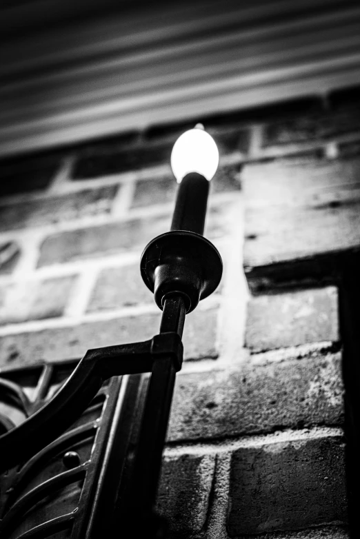 black and white pograph of street light on lamppost