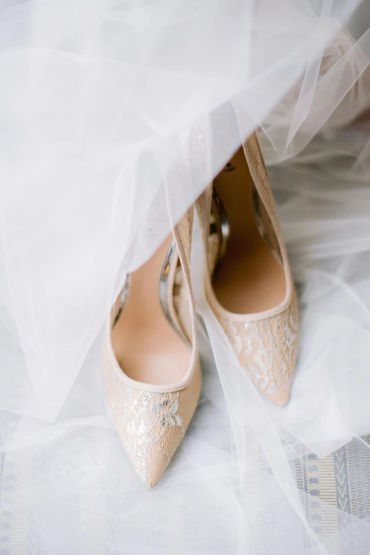 a couple of wedding shoes are sitting on a table