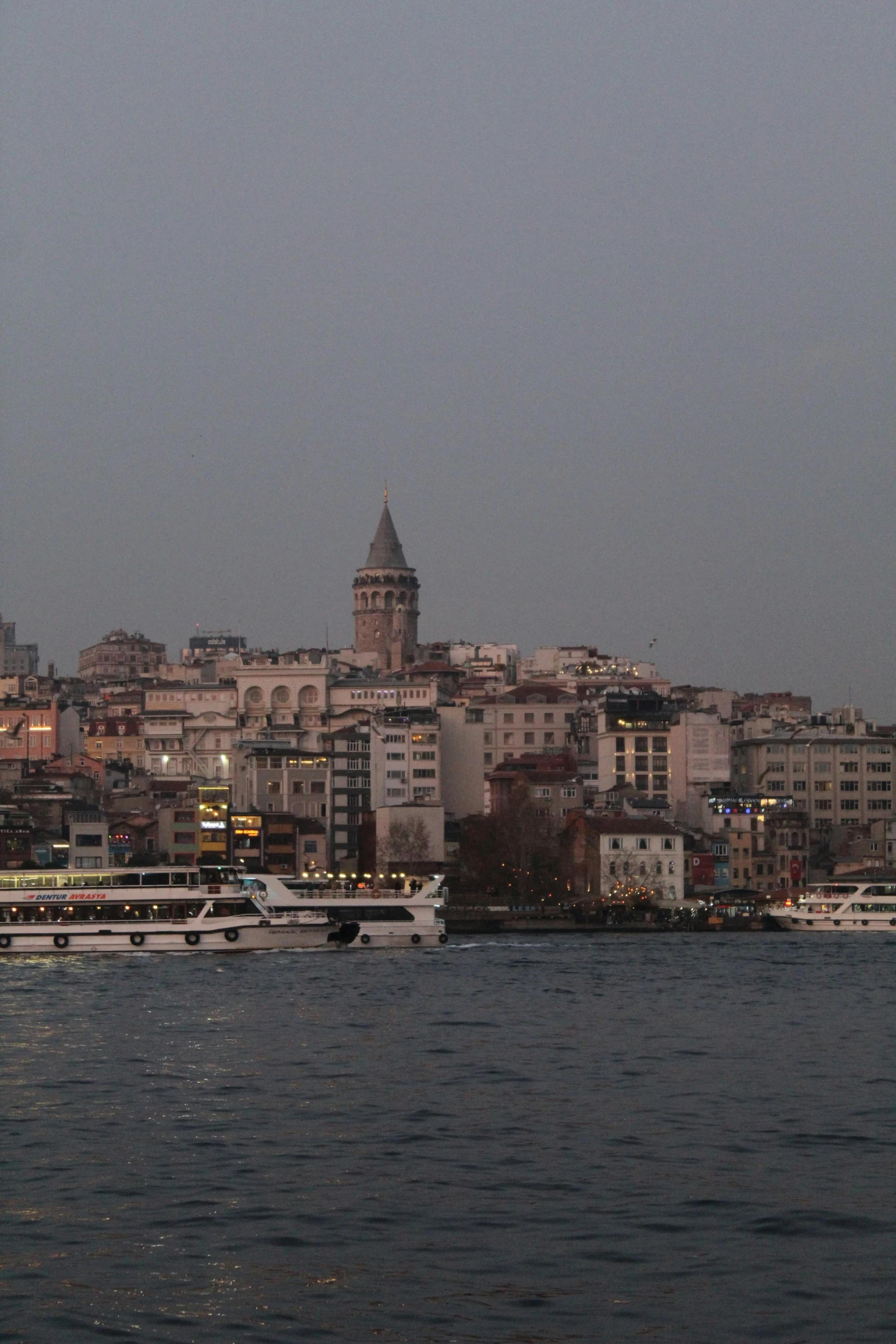 a city by the sea with boats floating on the water