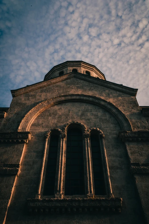 a tower with three arched windows is shown