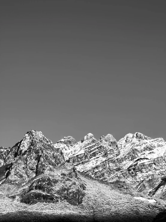 the mountain is very tall and black and white