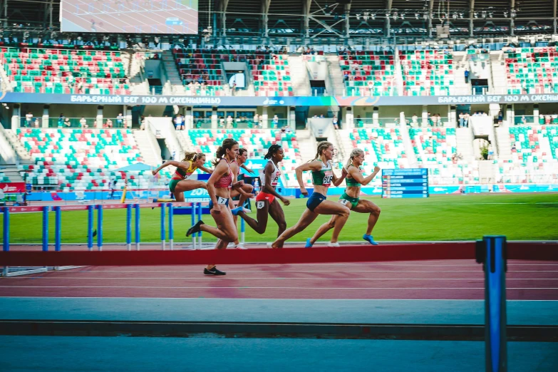 a group of women on running in an outdoor track