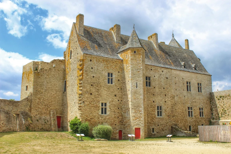 a large stone house with many windows on it