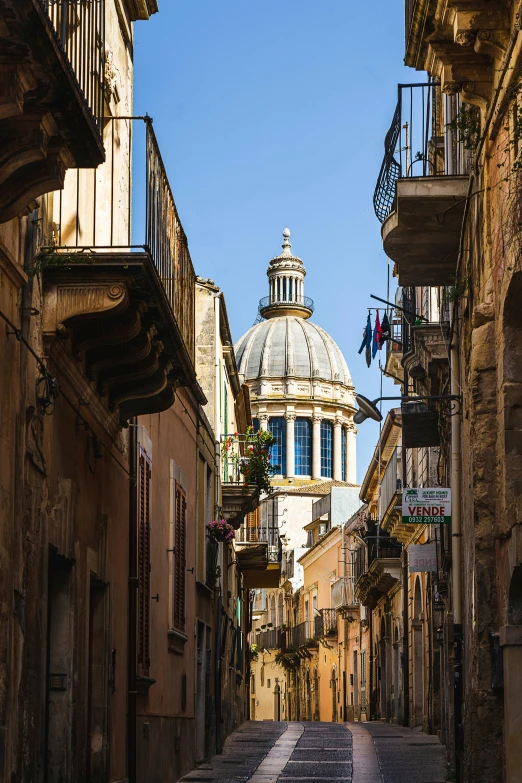 an old street is in the middle of an alleyway