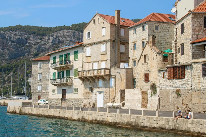 an old brick building that is by the water