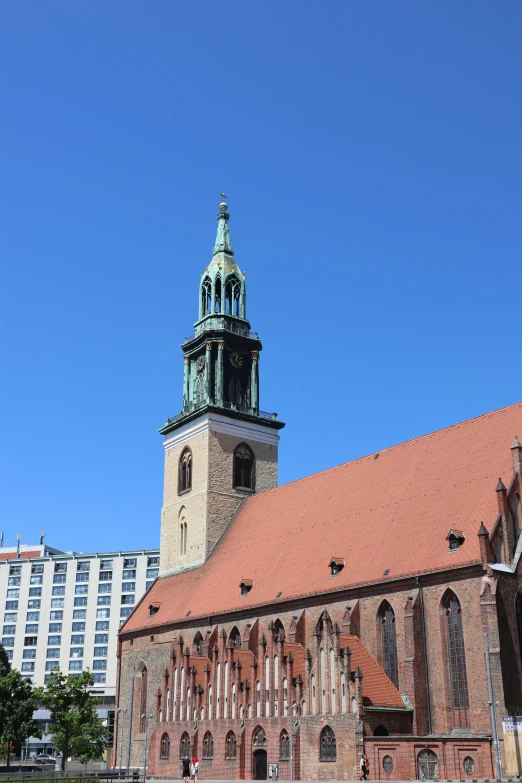 an old building with a steeple and green dome