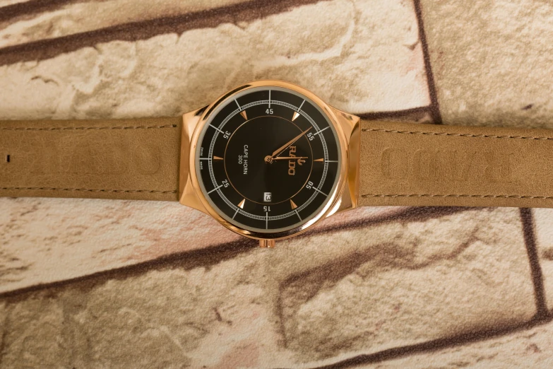 a watch that is on the bottom part of a leather belt