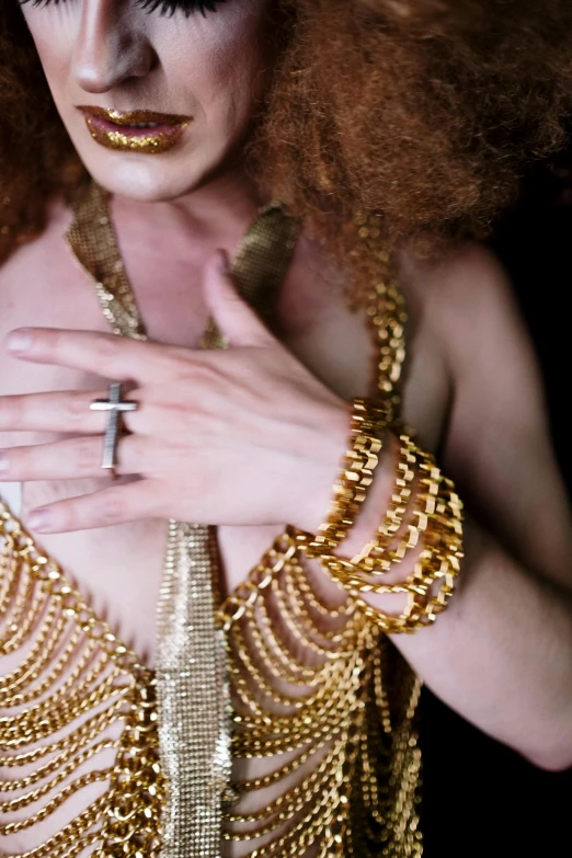 woman wearing gold dress and beaded jewelry