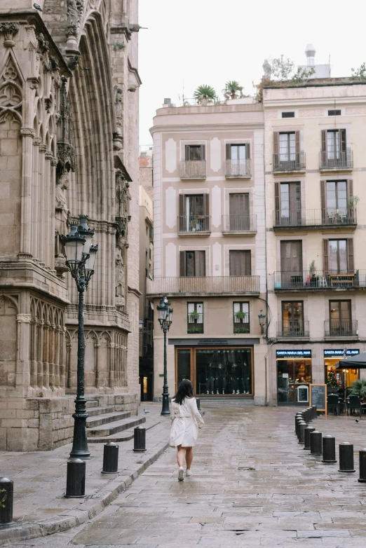 there are people walking down a busy street