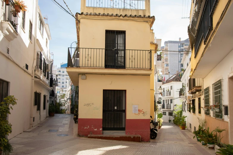 this is an alley with red and beige architecture