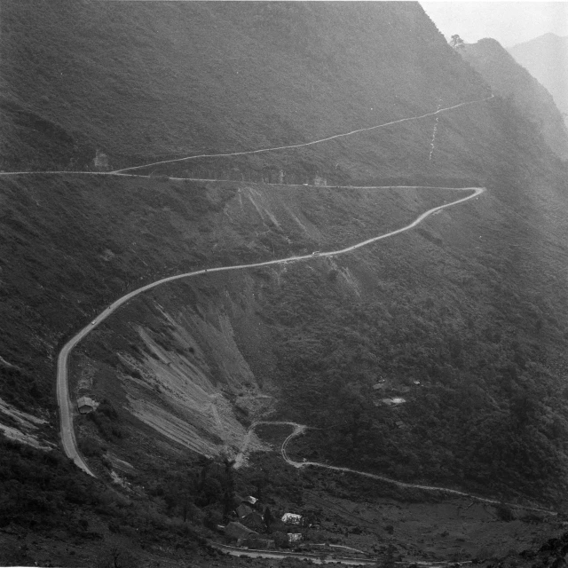 an aerial view of the road in the mountains