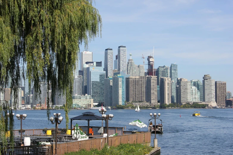 a very tall city and some water with boats