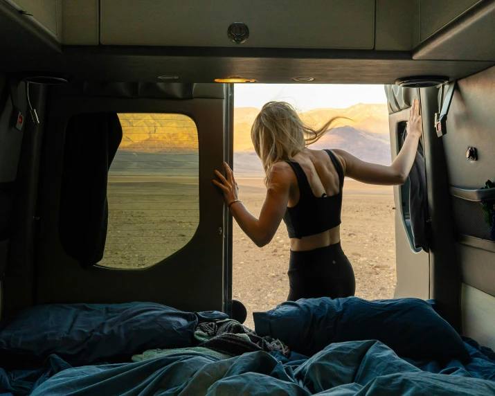 woman in a van doorway with large open door