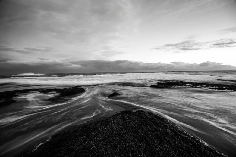 waves on the beach during a cloudy day