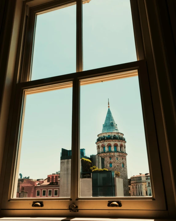 looking out a window with the skyline in the background