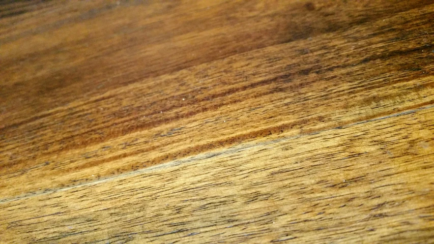 a brown wooden table with a red stop sign