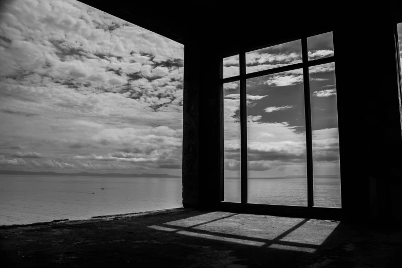 a window with a view of the ocean