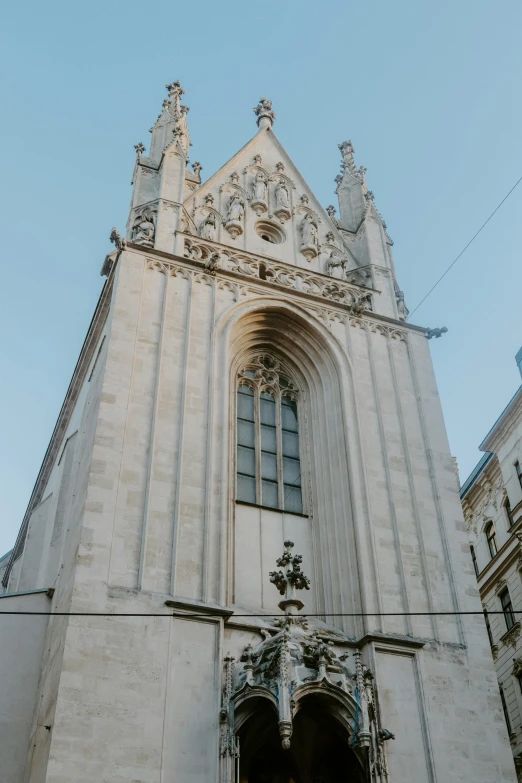 a tall building with a massive door on the side