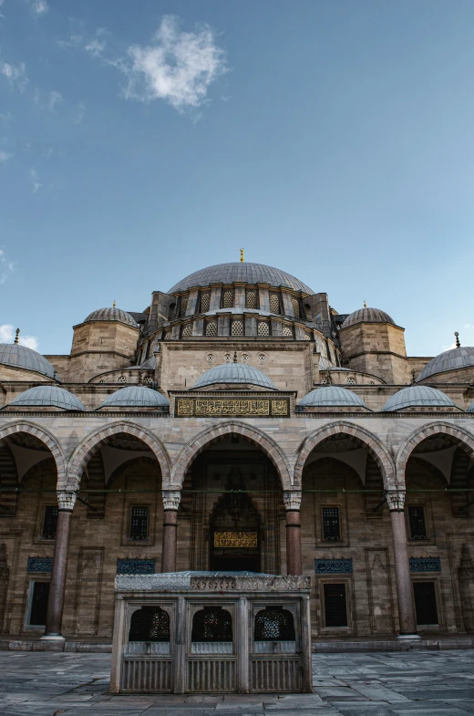 a very large old building with domes and arches