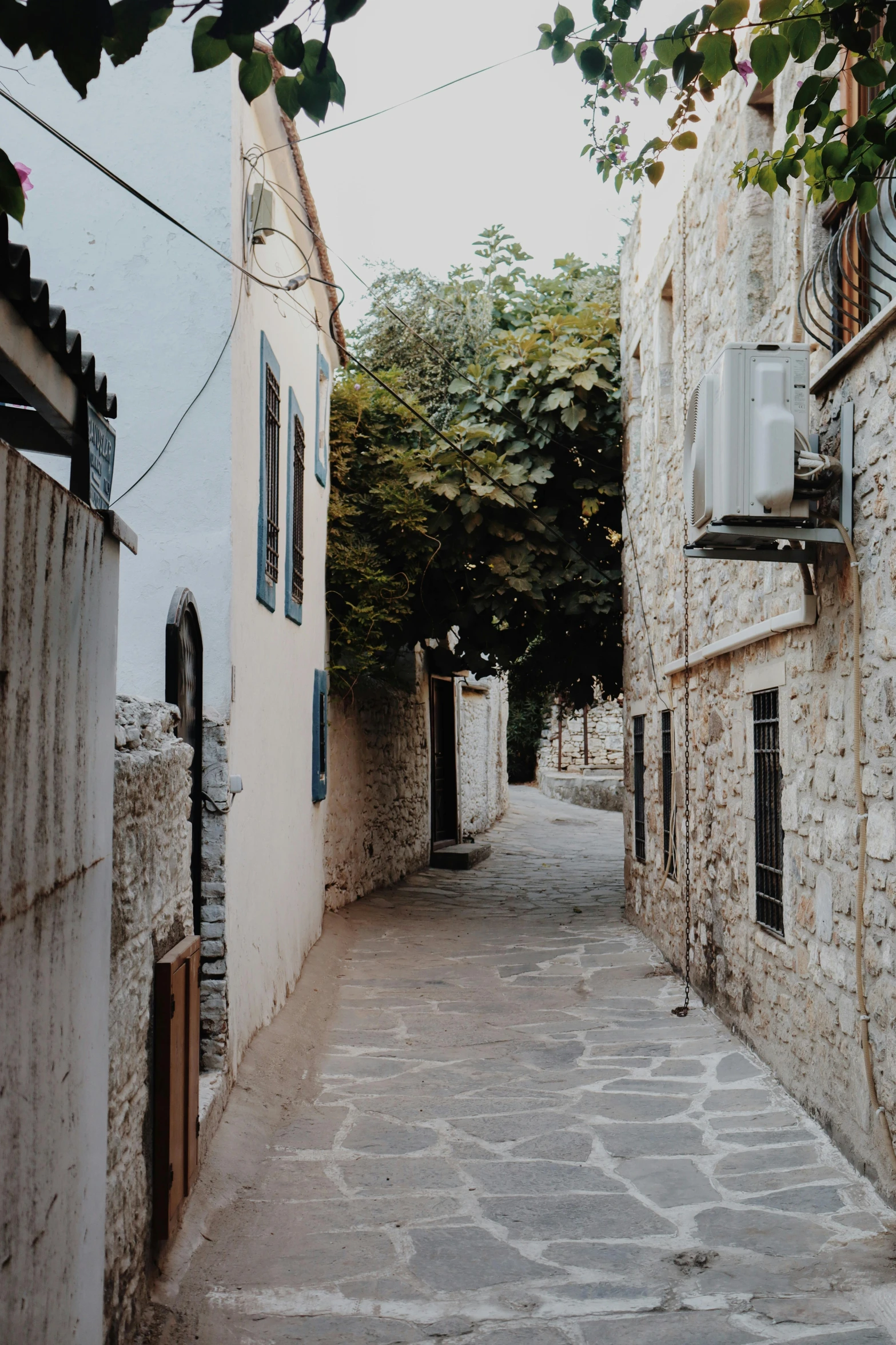 there is a stone street in the middle of the town