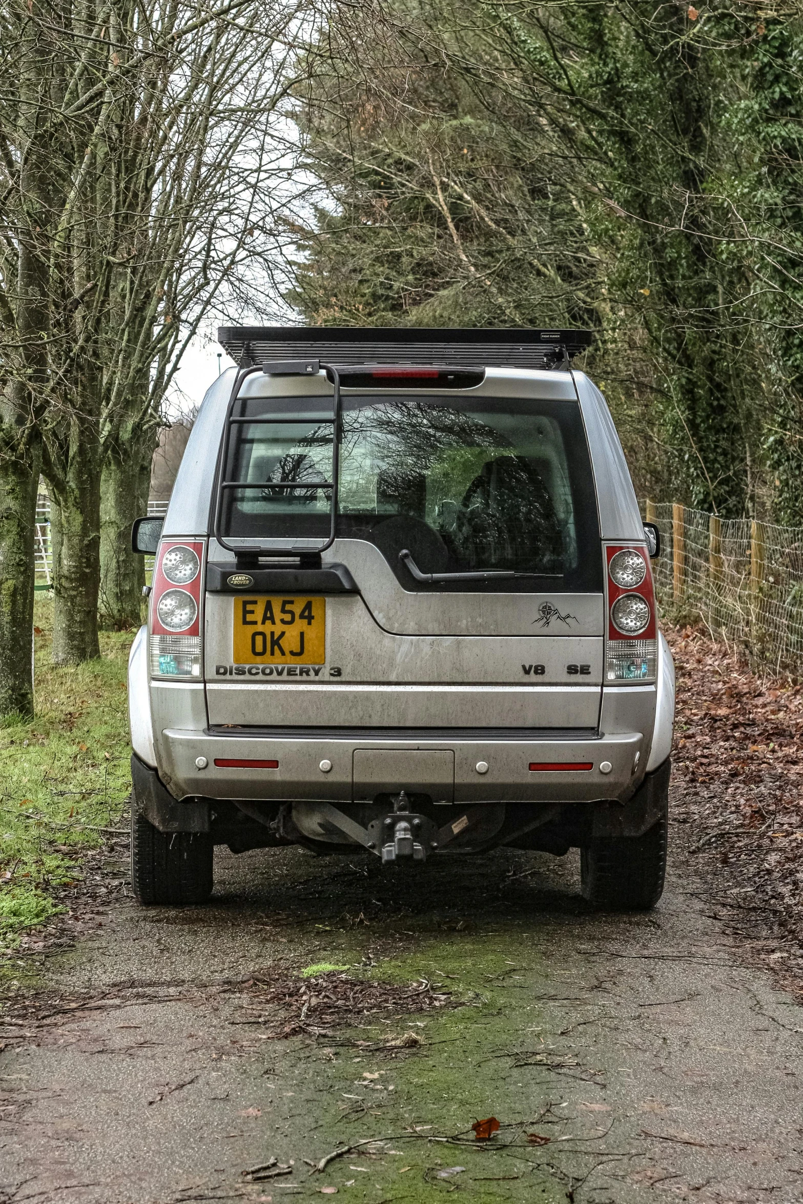 a suv parked along the side of a road